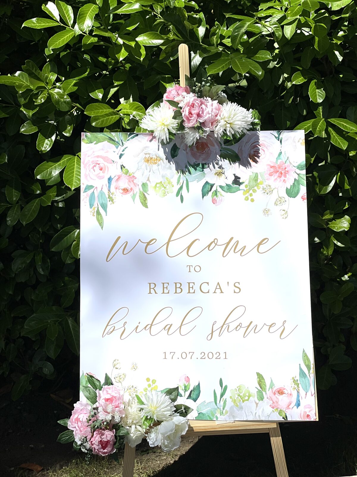 Floral welcome sign styled for a bridal shower